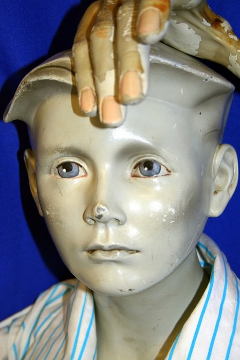 sculpture of a blue-eyed child