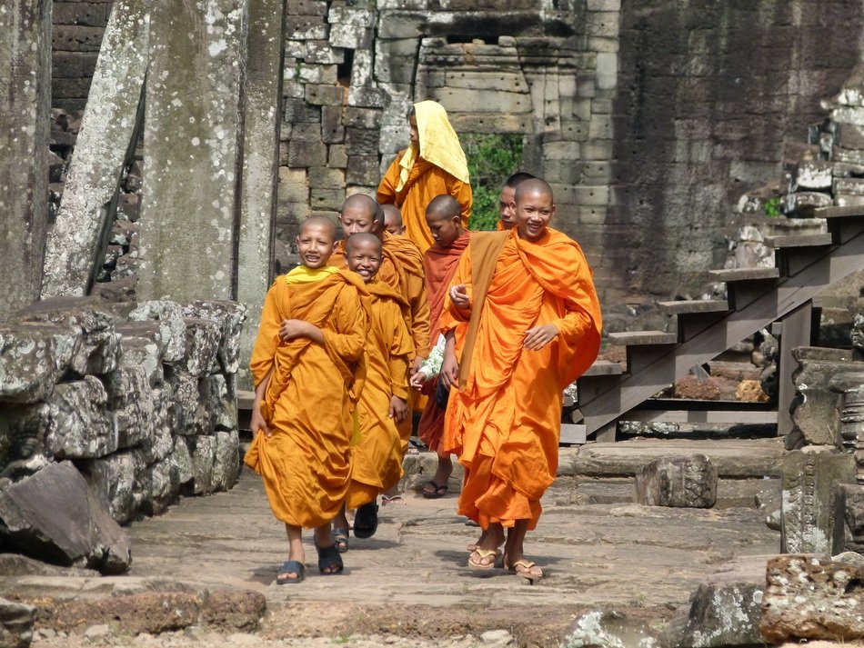 Buddhists on the background of the temple in Cambodia