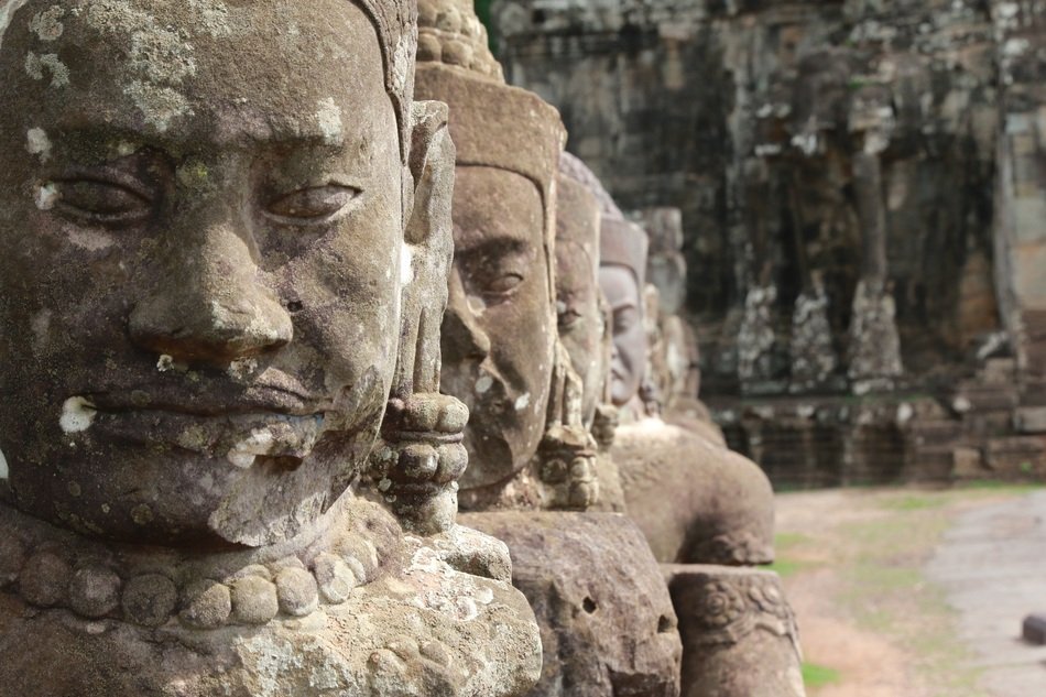 huge sculptures in a cambodian temple