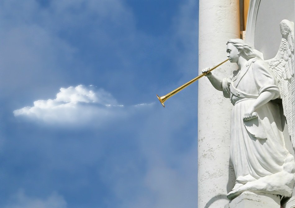 white angel with a pipe on the facade