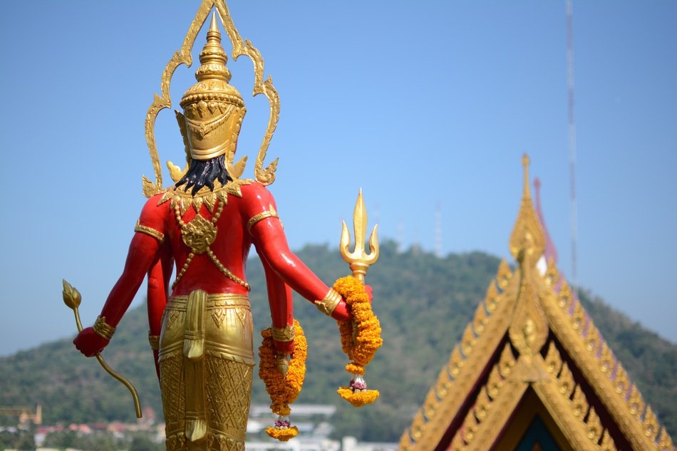Beautiful and colorful statue in Thailand at background with the hill