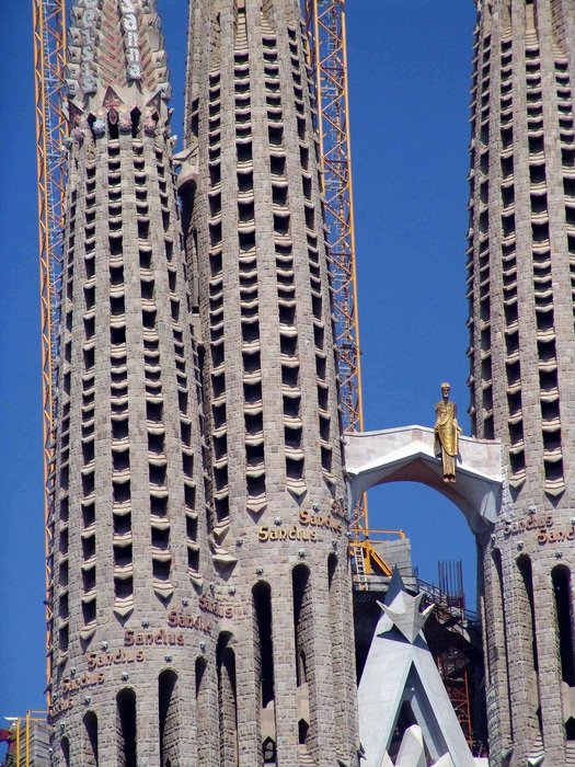 Beautiful exterior of the Sagrada Familia in Barcelona at blue sky background