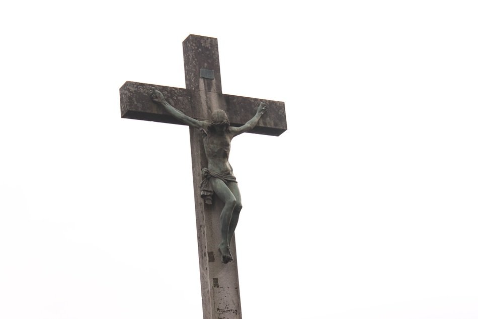 grey stone crucifixion at white background