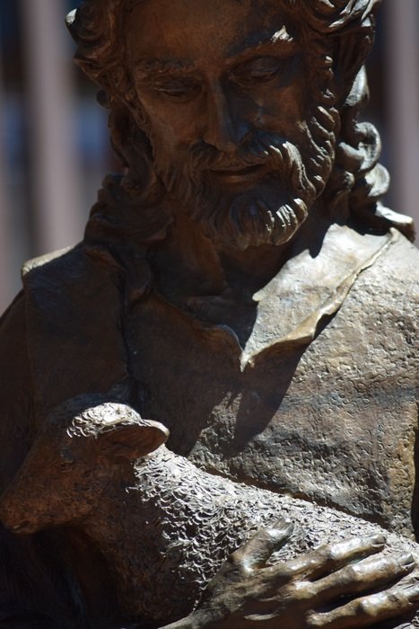 statue of Jesus with a lamb in his arms
