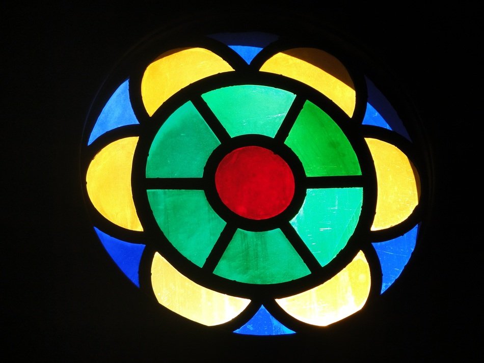 multicolored stained glass window in a catholic church