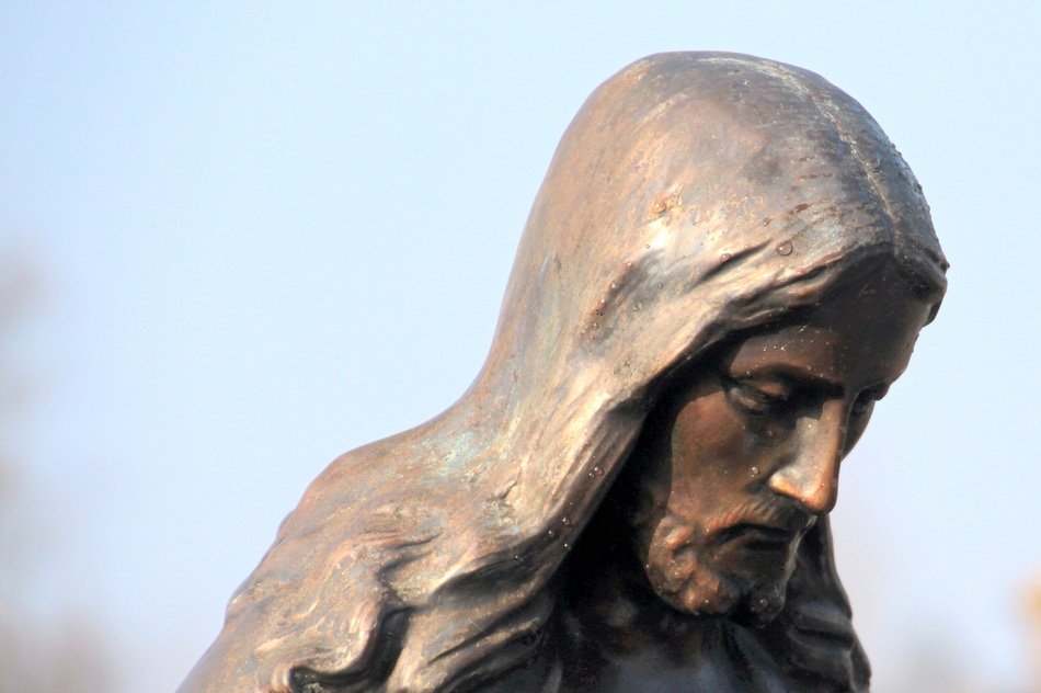 statue of looking down Christ