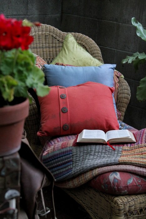 chair with cushions and open book