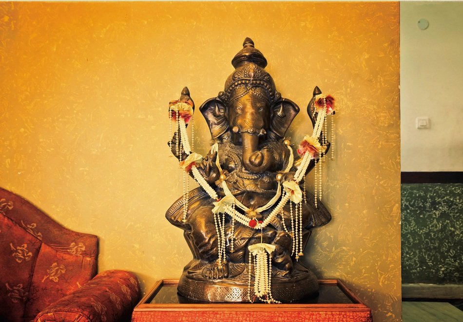 golden ganesha statue in the room