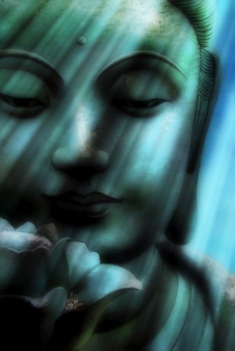 buddha head under light rays