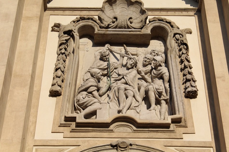 relief on the church in the form of the crucifixion of Jesus in Lombardy, Italy