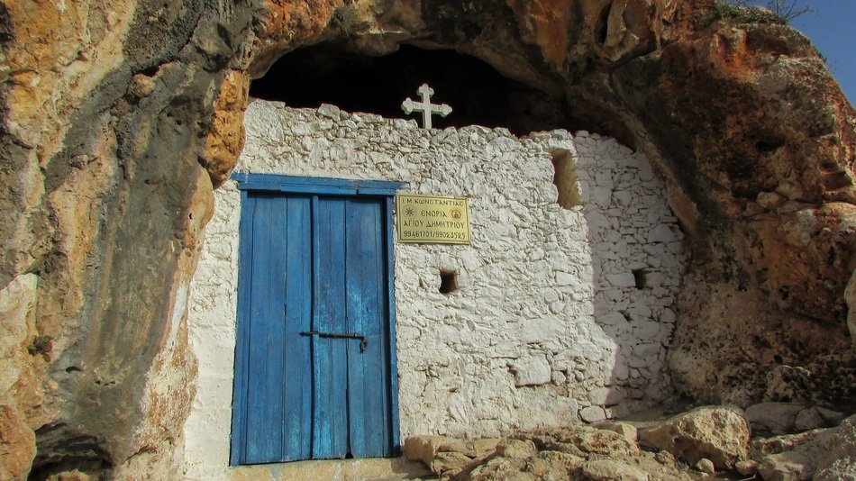 historical stone chapel in cave in Ayii Saranta