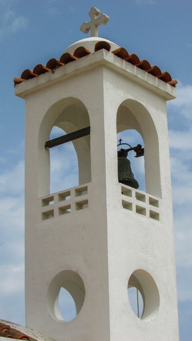 white belfry of a church in Ayia Marina