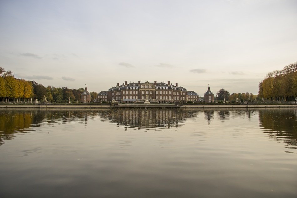 castle in the distance by the lake