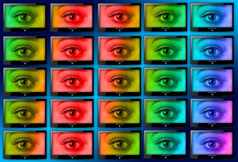 wall of monitors with colorful eyes pictures