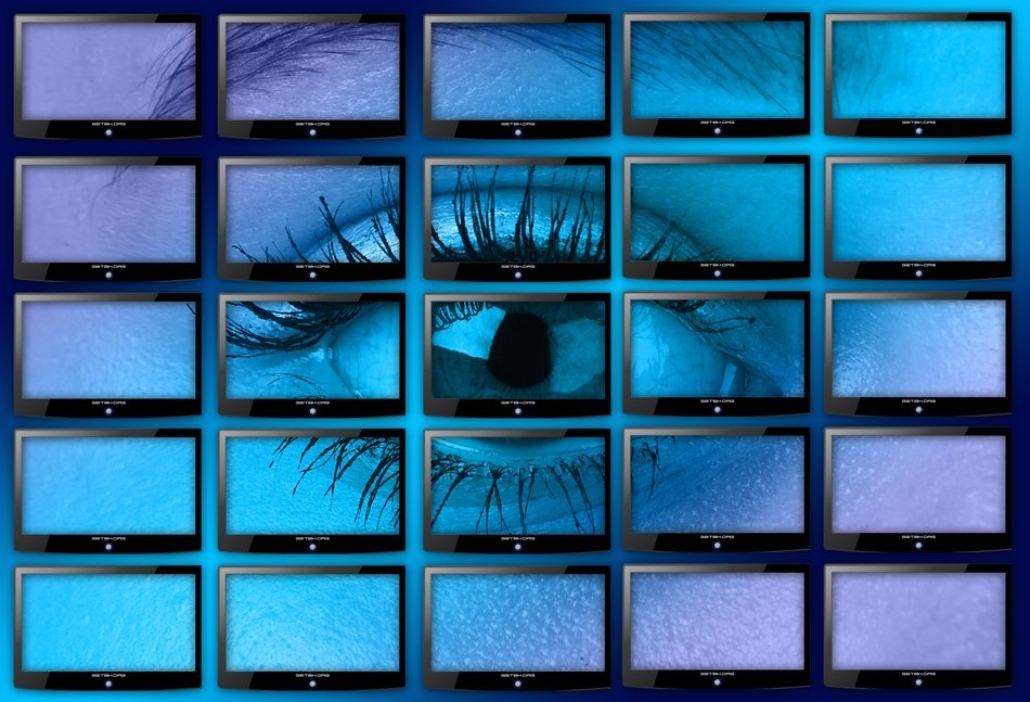 wall of monitors with eye picture