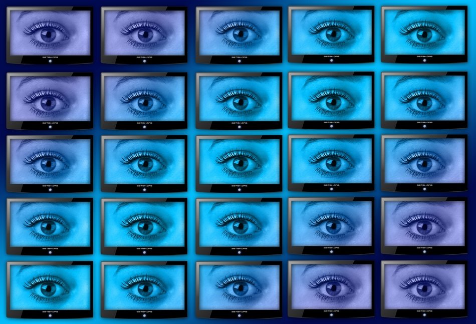 wall of monitors with eyes pictures