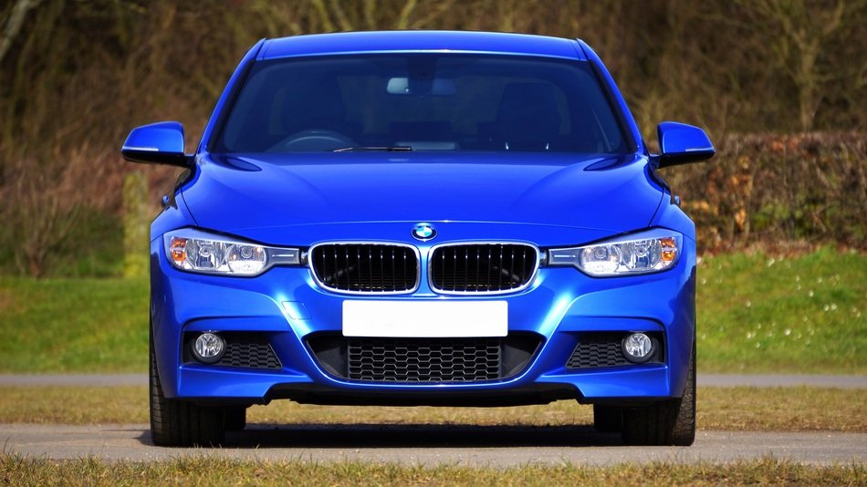 luxury blue BMW in the park