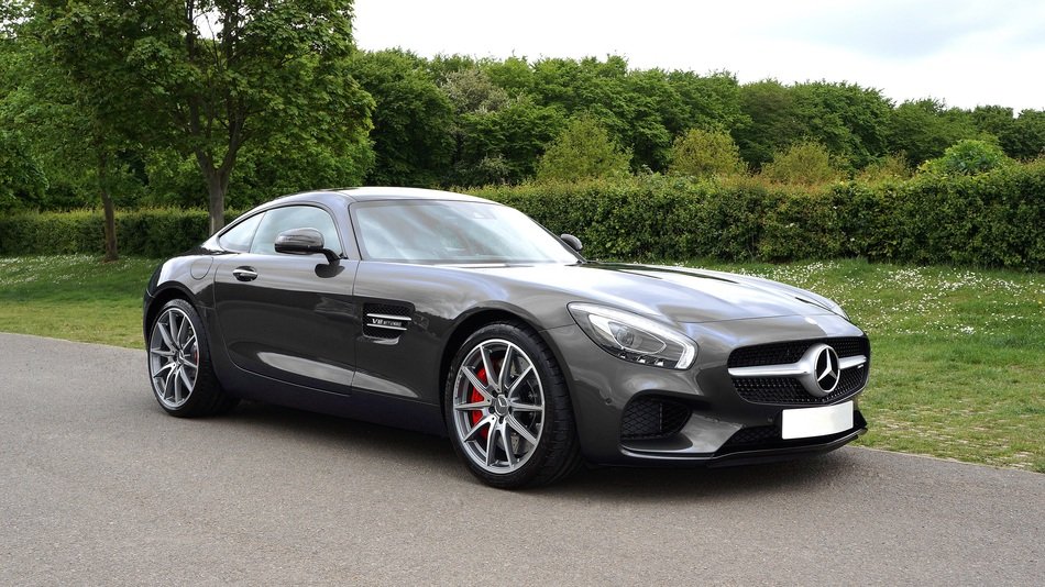 luxury dark mercedes in the park