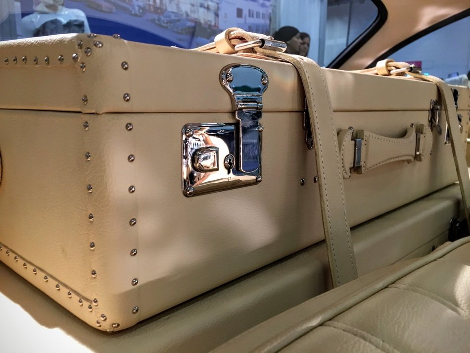 suitcase in the cabin of a luxury Mercedes