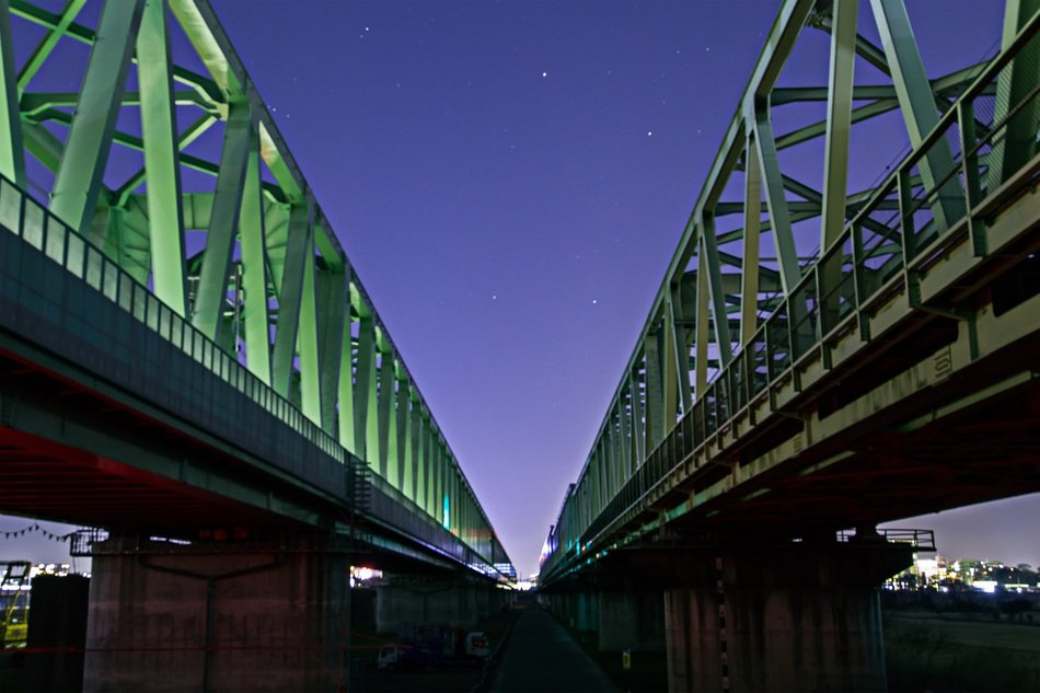 night starry sky over the railway bridge