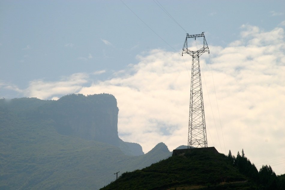 power transmition tower on mountain at sky