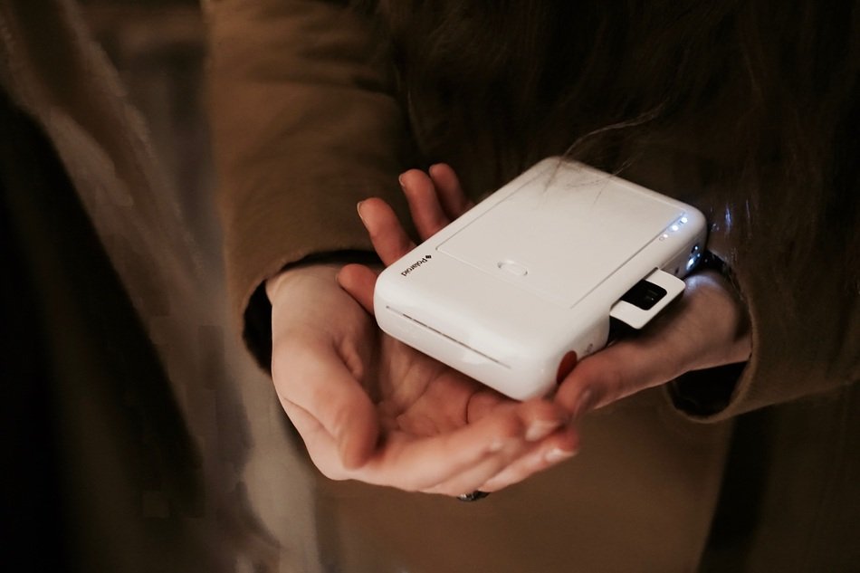 Instant camera in human hands