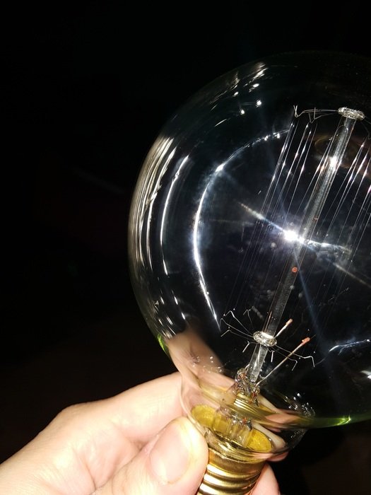 glass bulb in a manâs hand