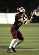 American football player in a maroon form