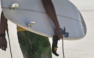 Surfer man and surfboard