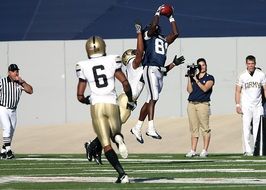 leader with a ball in american football