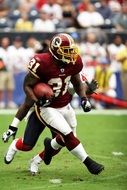 players with a ball in american football