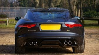 rear view of a black sports car jaguar