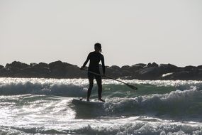 Photo of Surfer is on a surfboard