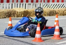 athlete in karting car