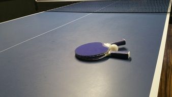 rackets and balls on the tennis table