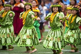 hawaiian hula dancer in green dresses