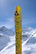 yellow fisher ski at snowy mountains, switzetland, pizol