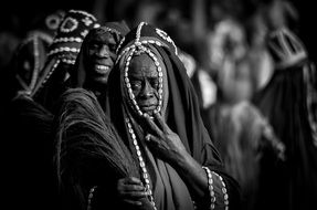 black and white photo of african dancers in a special wear