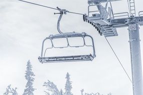 frosted Chairlift at cloudy sky