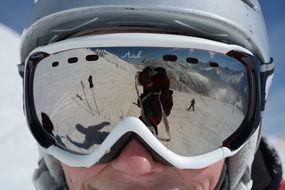 face of a man in mirrored glasses