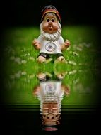dwarf soccer player is reflected in the water