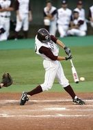 baseball player batting a ball