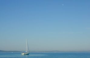 Sailing Boat on calm sea at morning