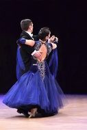 couples dance tango on stage