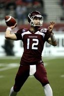 American football quarterback on the competition