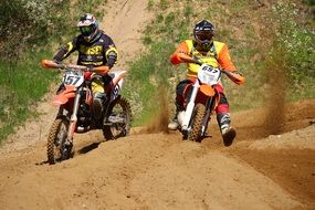 two riders on the track in motocross