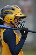 girl in a helmet in a female softball