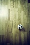 Black and white football ball on the floor