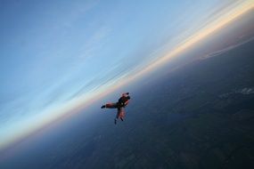 Skydiver high in the beautiful sky
