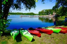 multi-colored kayaks on the lake